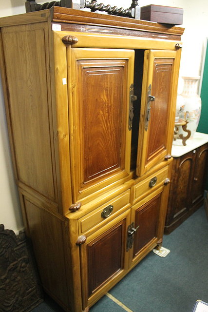 Appraisal: A CHINESE TWO PART CABINET fitted drawers and cupboards with