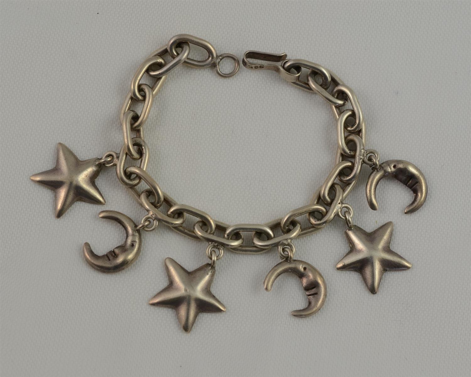 Appraisal: Sterling silver charm bracelet star moon charms unmarked TO