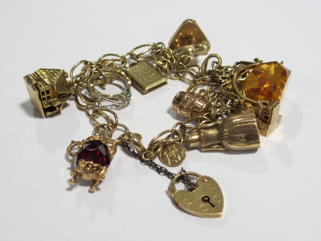 Appraisal: Nine carat gold charm bracelet with thirteen various small to