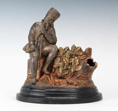 Appraisal: A Large Monochrome Figural Match-Strike of Seated Hunter Terracotta with