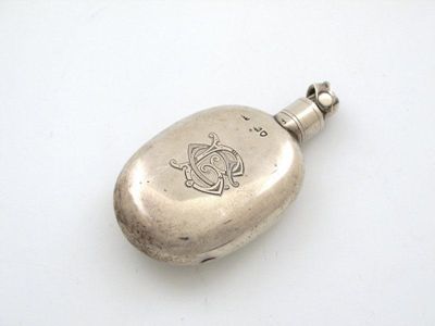 Appraisal: A Victorian silver hipflask of oval form the screw off