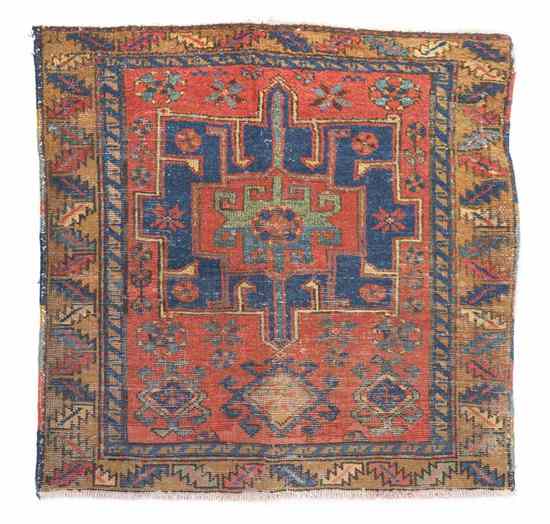 Appraisal: A Heriz Wool Rug having a geometric center medallion within