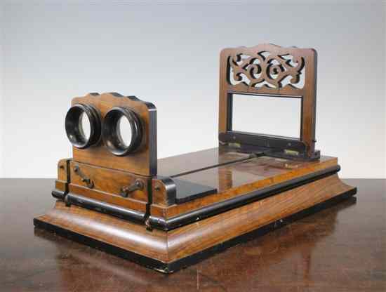 Appraisal: A Victorian walnut adjustable stereoscopic viewer on plinth base in