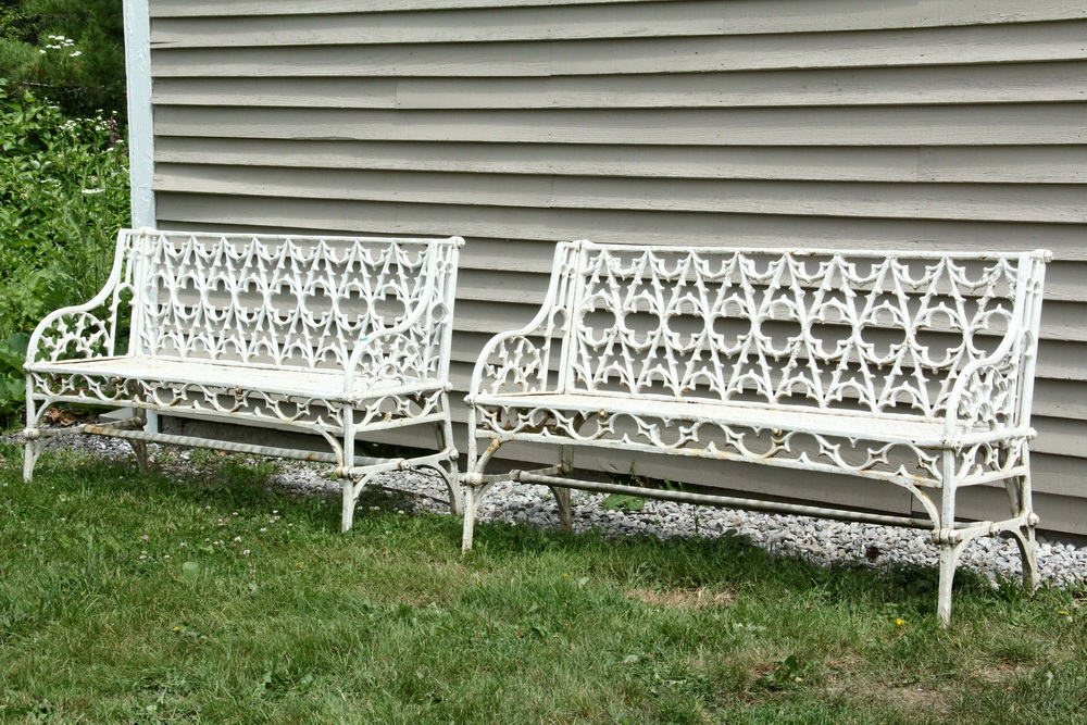 Appraisal: PAIR OF CAST IRON GARDEN BENCHES - English Aesthetic Period