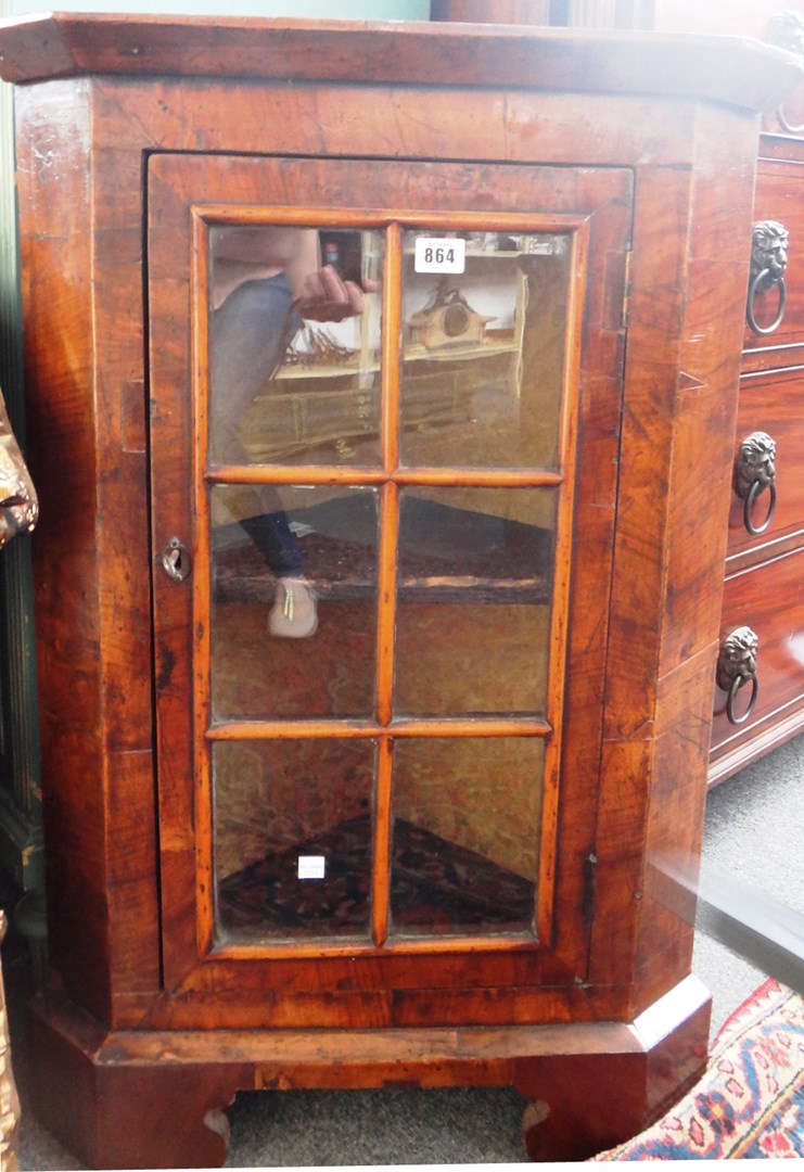 Appraisal: An th century and later walnut corner cupboard with single