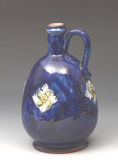 Appraisal: A ROYAL DOULTON COBALT BLUE STONEWARE JUG with simple flower