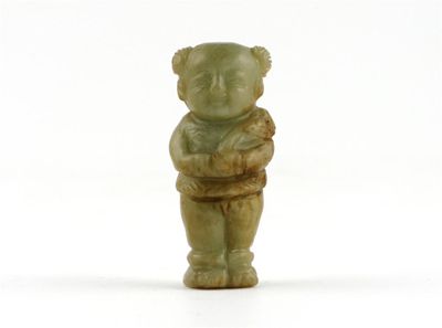 Appraisal: A small Chinese hardstone carving of a boy standing holding