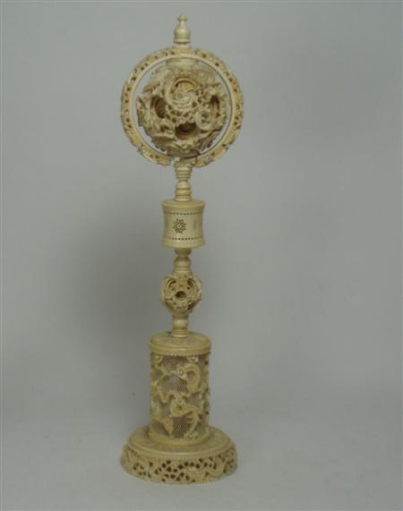 Appraisal: An early th century Chinese ivory puzzle ball on stand