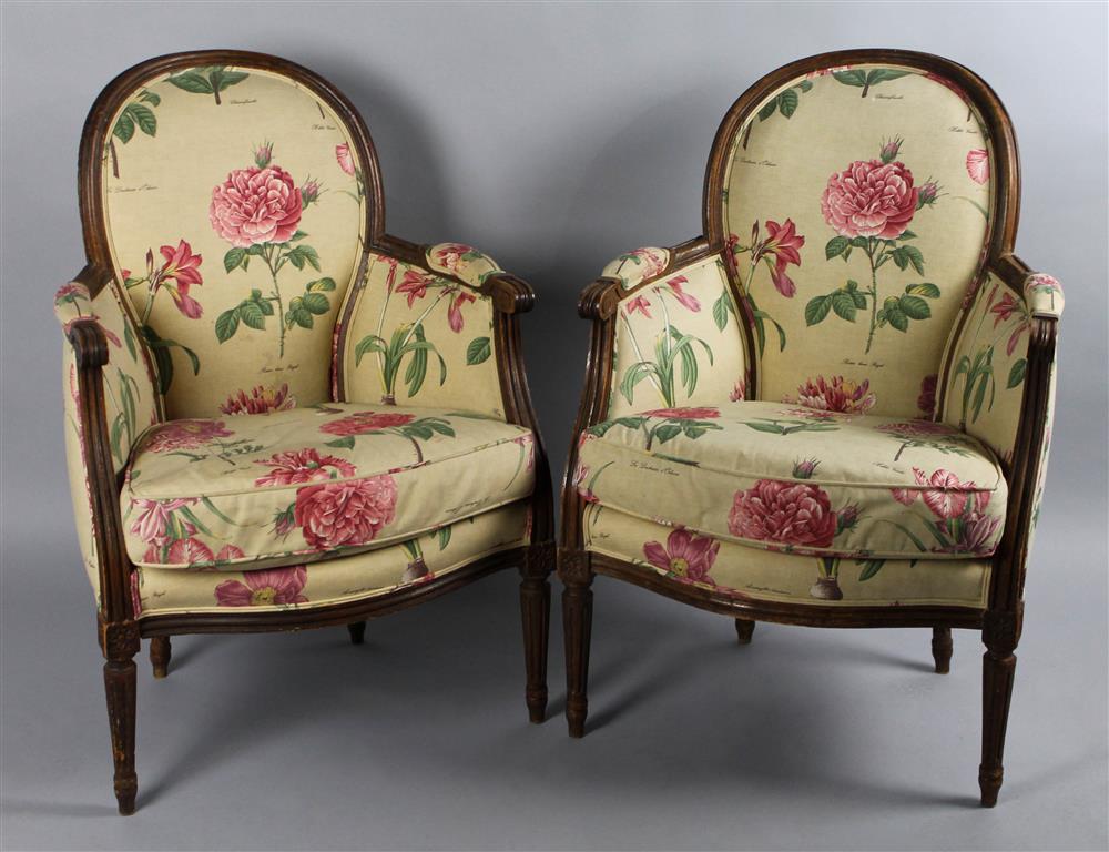 Appraisal: PAIR OF LOUIS XVI STYLE BERGERES WITH BOTANICAL UPHOLSTERY having