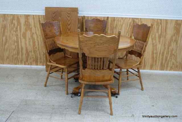 Appraisal: Oak Round Pedestal Dining Table w ChairsFrom an estate is