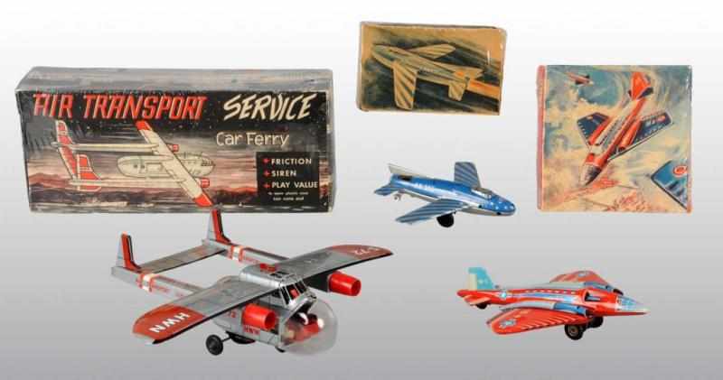 Appraisal: Lot of Tin Airplane Friction Toys Description German Working Includes