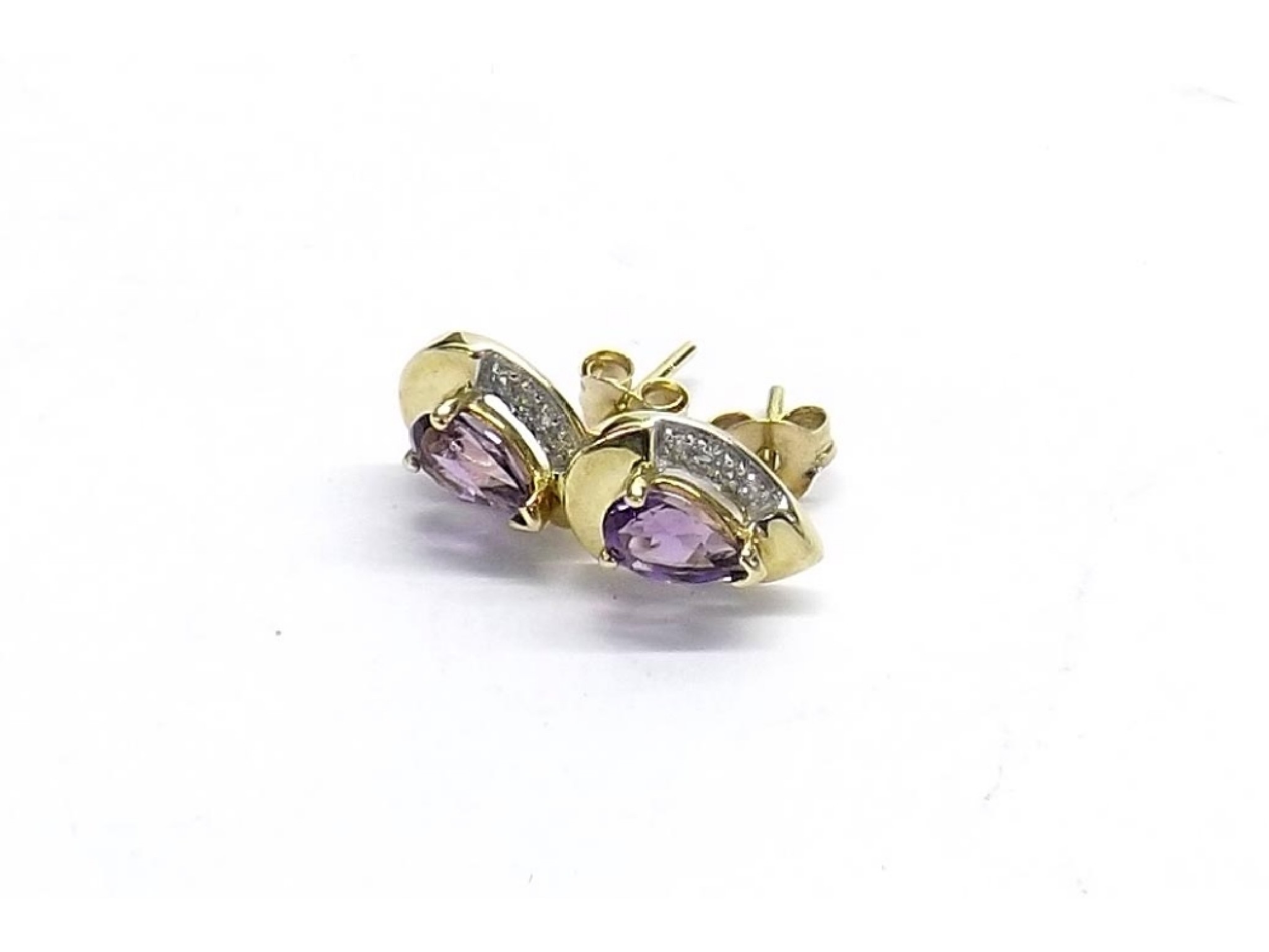 Appraisal: Pair of amethyst and diamond pear shaped ear studs in