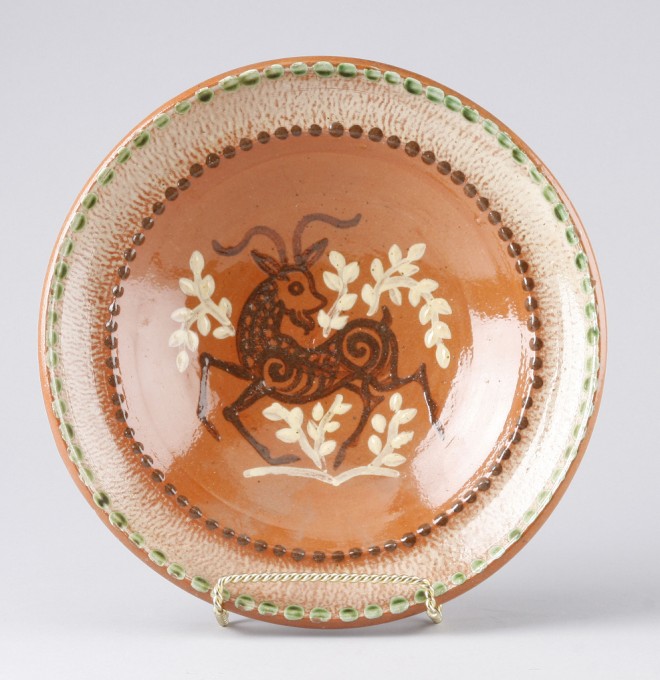 Appraisal: Redware bowl features deer motif at center diameter t marked