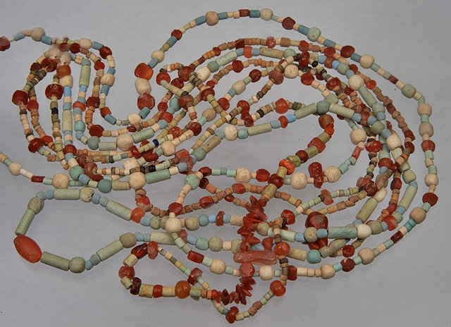 Appraisal: A COLLECTION OF FOUR CORNELIAN AND CLAY BEAD NECKLACES to