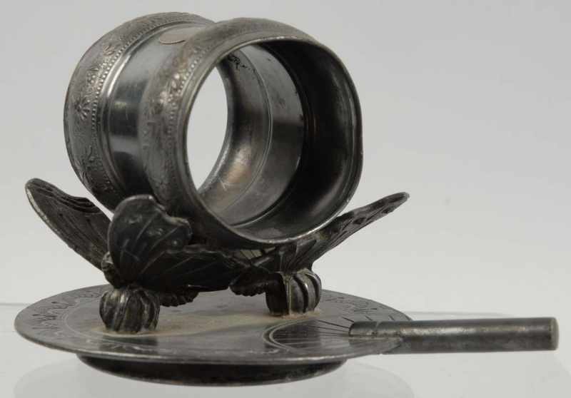 Appraisal: Figural Napkin Ring Sitting on Butterfies Description Made by the