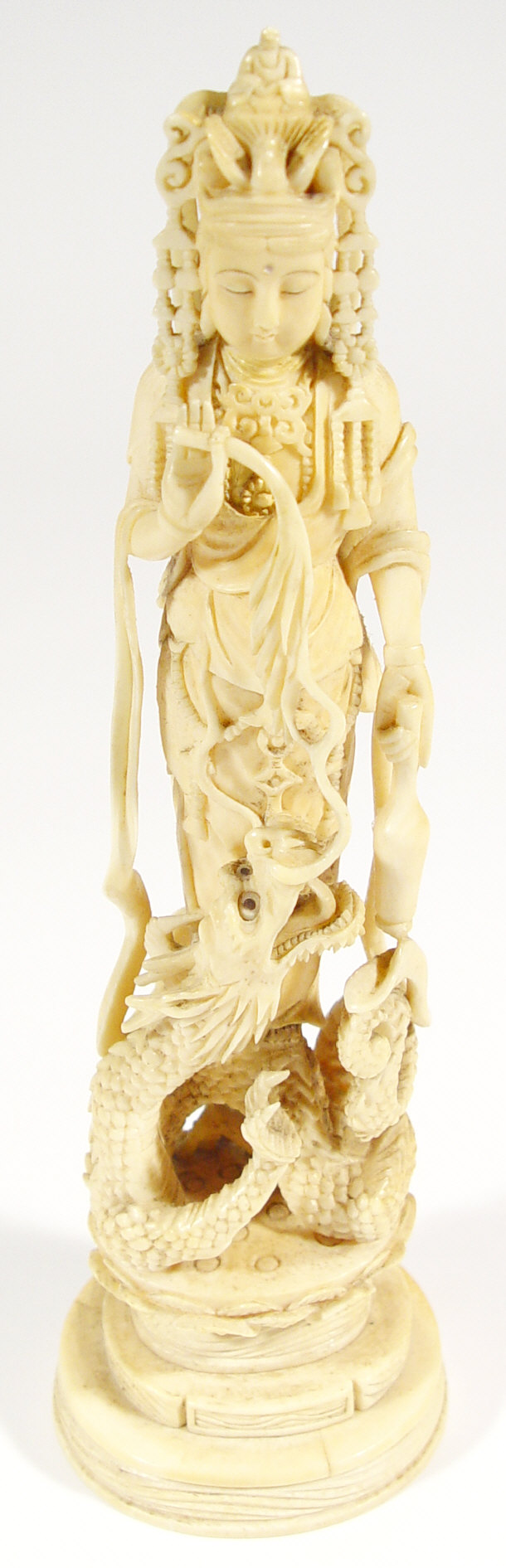 Appraisal: Oriental ivory carving of a goddess teasing a scaled dragon