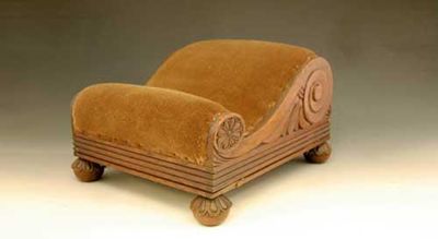 Appraisal: A Regency mahogany foot stool carved with a leaf scroll