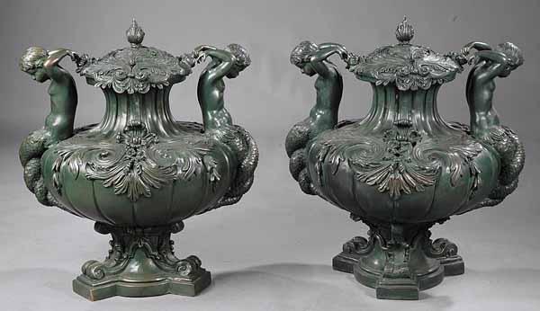 Appraisal: A Pair of Neoclassical Style Bronze Figural Urns with Covers