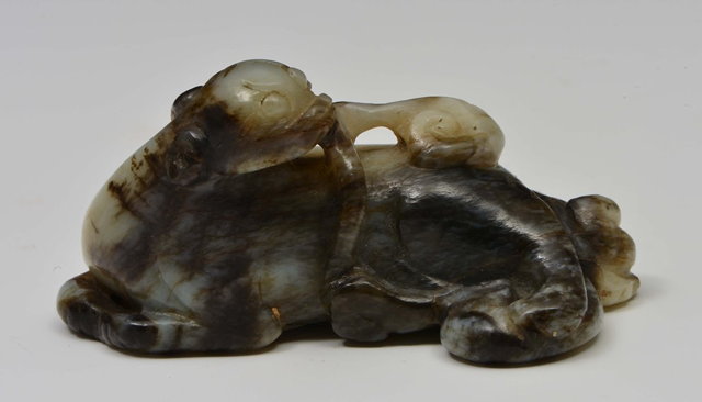 Appraisal: A CHINESE BLACK AND GREY JADE ORNAMENT carved as a