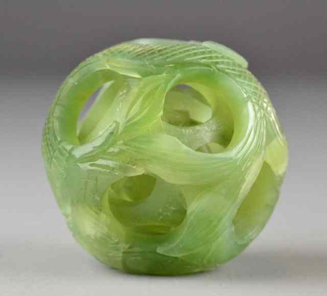 Appraisal: Chinese Serpentine Jade Puzzle BallCarved to depict a dragon with