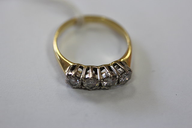 Appraisal: AN CT GOLD FOUR STONE DIAMOND SET RING