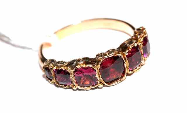 Appraisal: A SEVEN STONE VICTORIAN GARNET SET DRESS RING foil backed