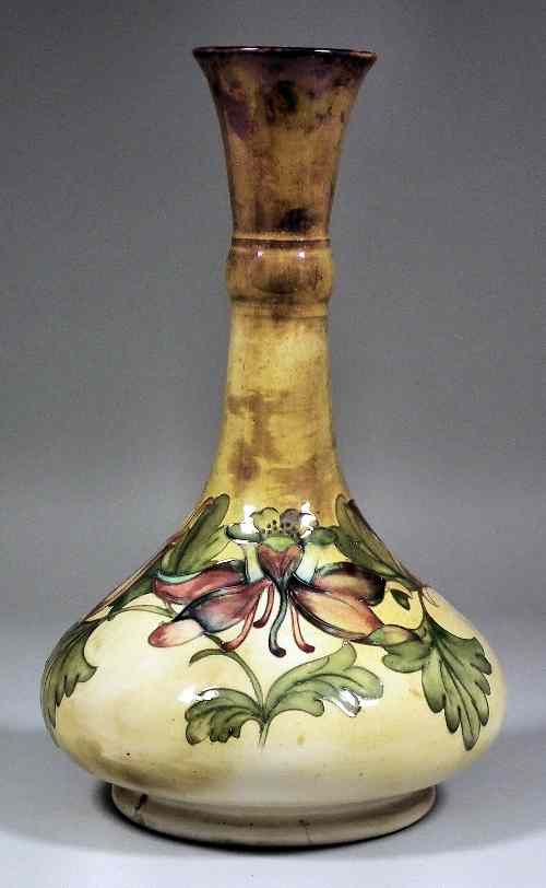 Appraisal: A Moorcroft pottery lamp base tube lined and decorated in