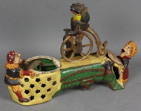 Appraisal: Circa cast iron mechanical bank Professor Pug Frog's Great Bicycle