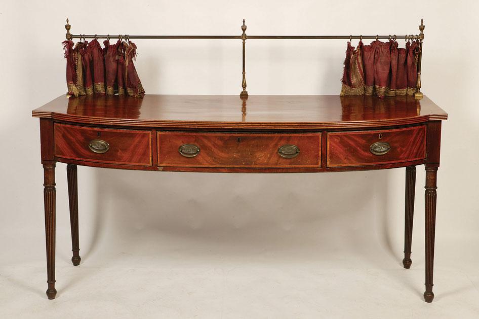 Appraisal: A LATE GEORGE III MAHOGANY BOW FRONTED SIDEBOARD the shaped