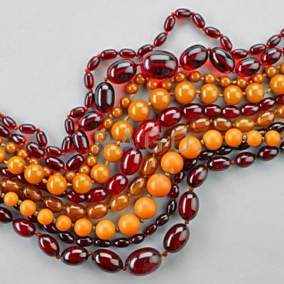 Appraisal: SIX STRANDS OF BAKELITE BEADS Graduated necklace resemble amber oblate