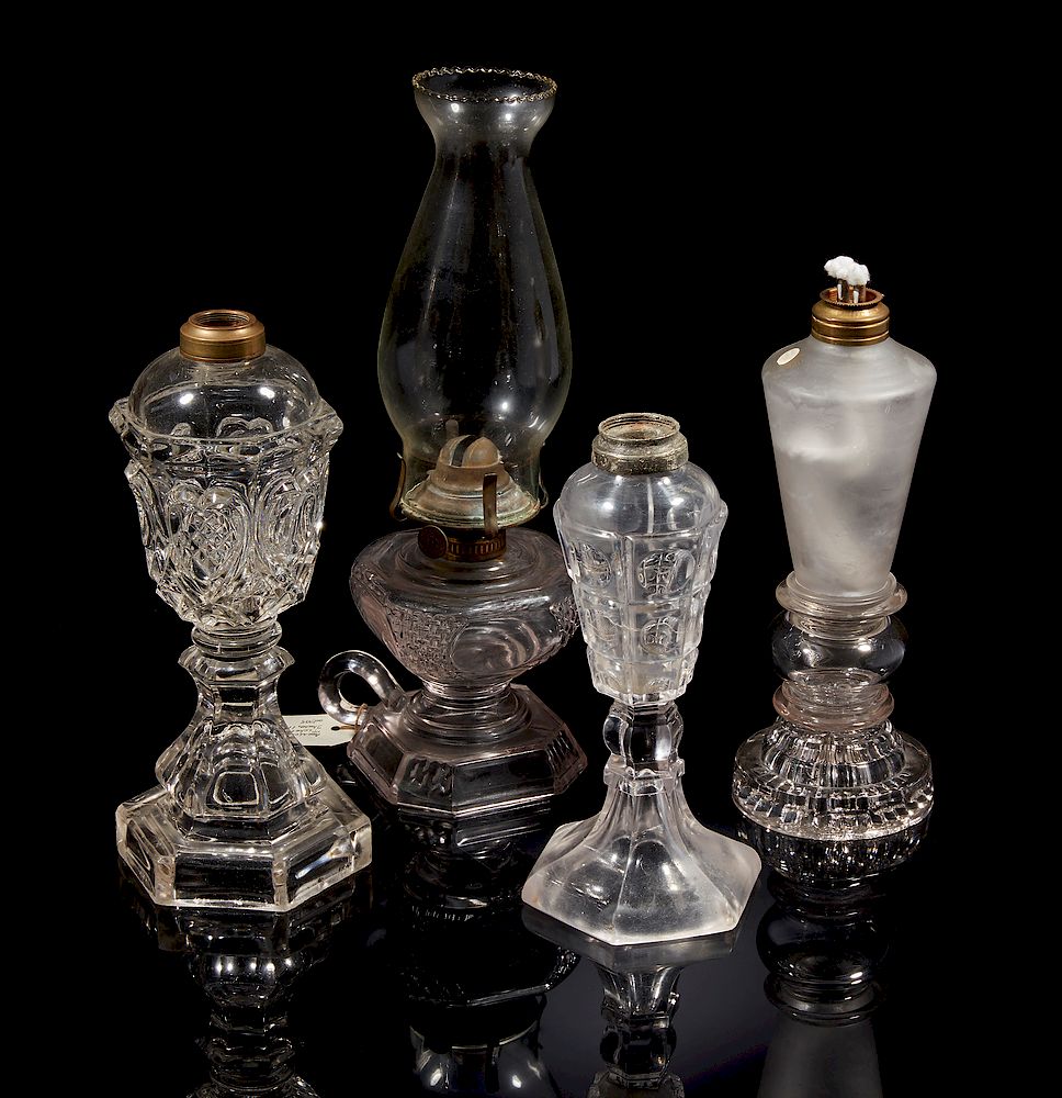 Appraisal: Four Glass Oil Lamps Four clear glass oil lamps one