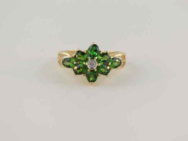 Appraisal: Tsavorite Garnet Ring rich green gems with diamond in center