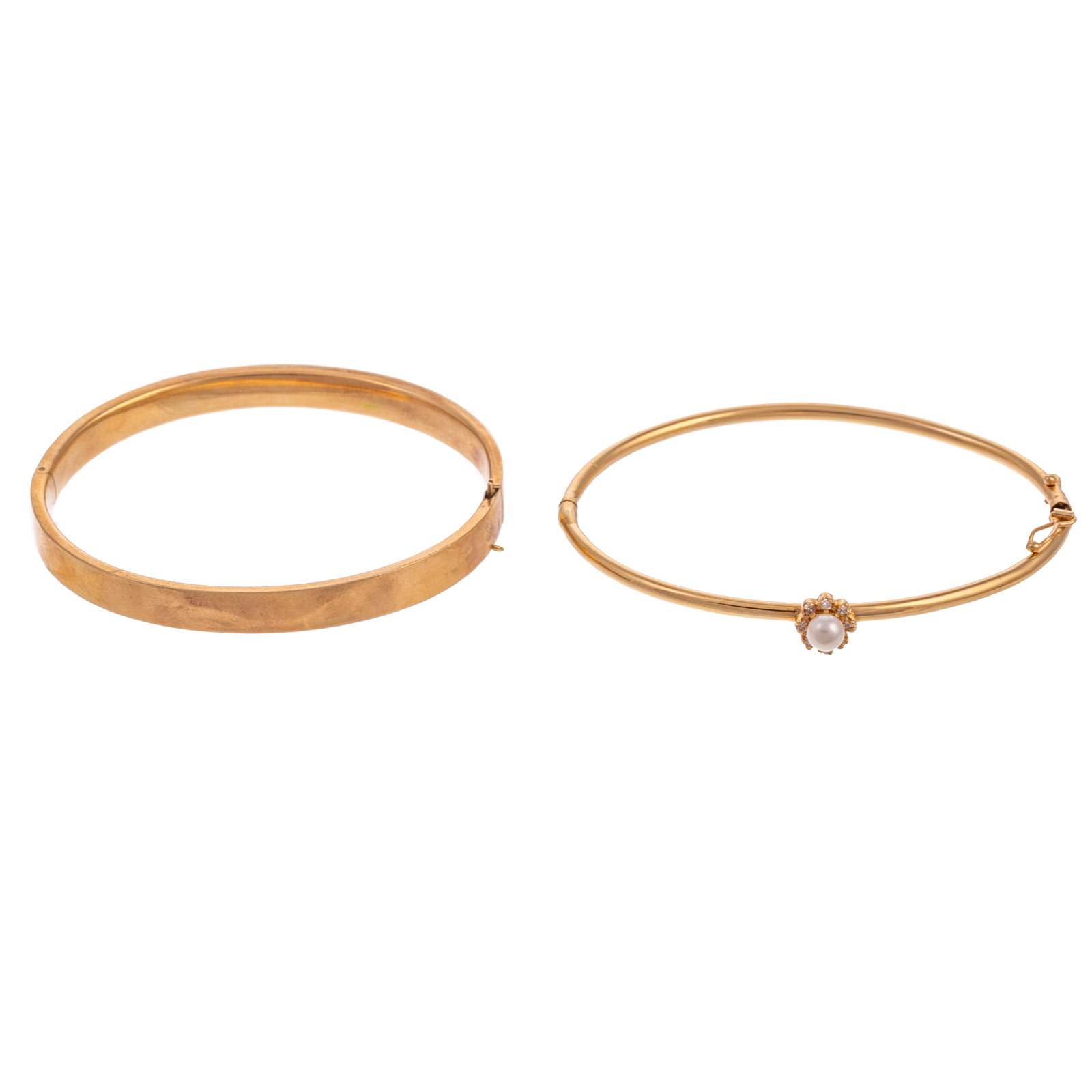 Appraisal: TWO K YELLOW GOLD BANGLES K yellow gold oval hinged