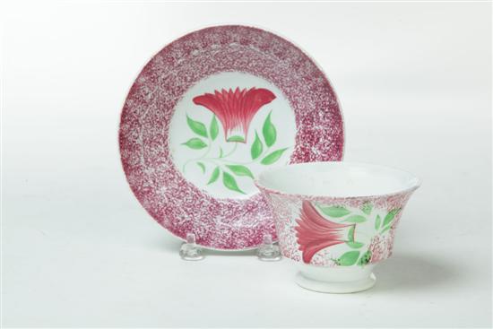 Appraisal: SPATTERWARE CUP AND SAUCER England nd quarter- th century Red