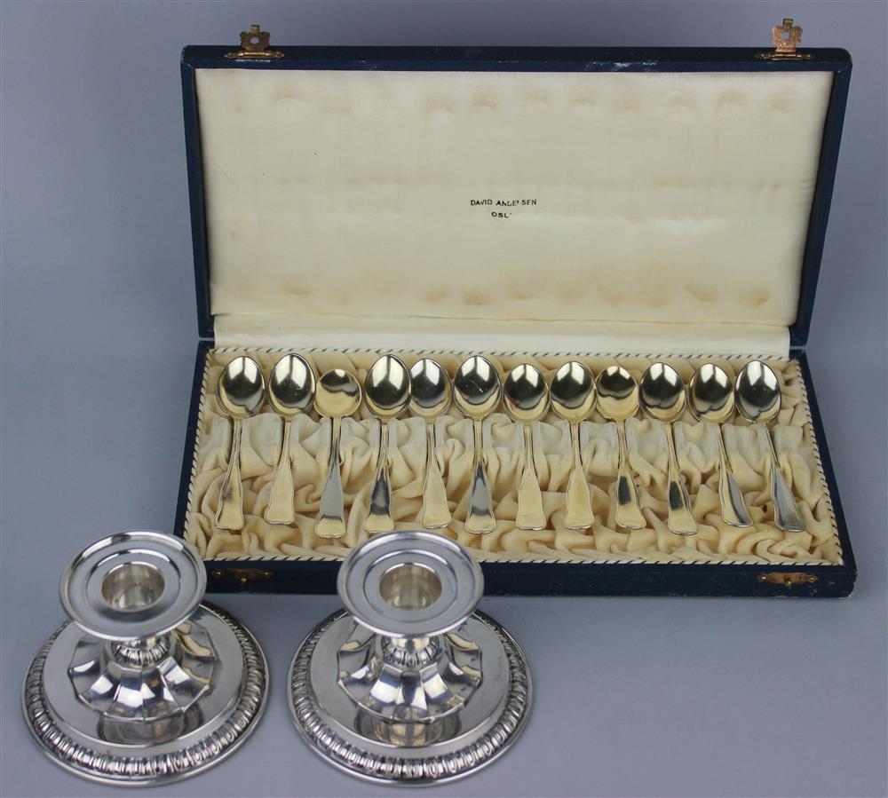 Appraisal: TWELVE NORWEGIAN CASED SPOONS AND PAIR OF CANDLESTICKS the set