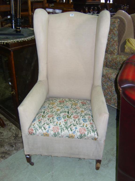 Appraisal: A Georgian style commode wing easy chair on square taper