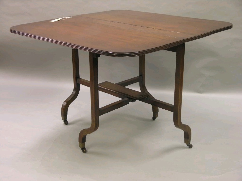 Appraisal: A reproduction mahogany Sutherland table on outswept legs and casters