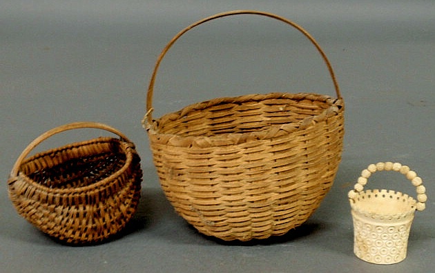 Appraisal: Two small woven baskets h h and an ivory bucket