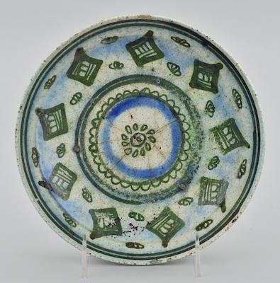 Appraisal: A Near Eastern Pottery Bowl Shallow bowl on the protruding