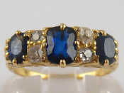 Appraisal: A yellow metal tests carat gold half hoop sapphire and