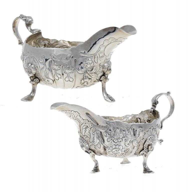 Appraisal: TWO IRISH GEORGE III SAUCE BOATS partially fluted one chased