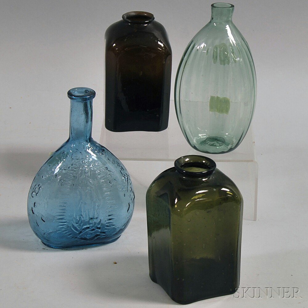 Appraisal: Four Blown Molded Colored Glass Bottles a small amber and