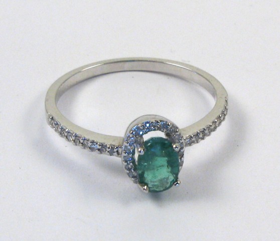 Appraisal: EMERALD AND DIAMOND RING k white gold centering an oval-cut