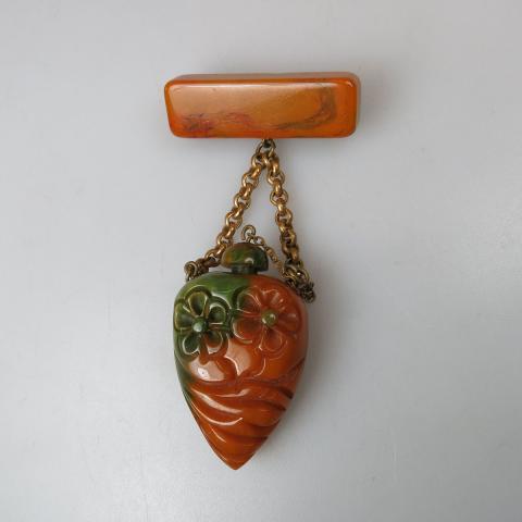 Appraisal: Carved Golden Bakelite Perfume Bottle Pin cm length