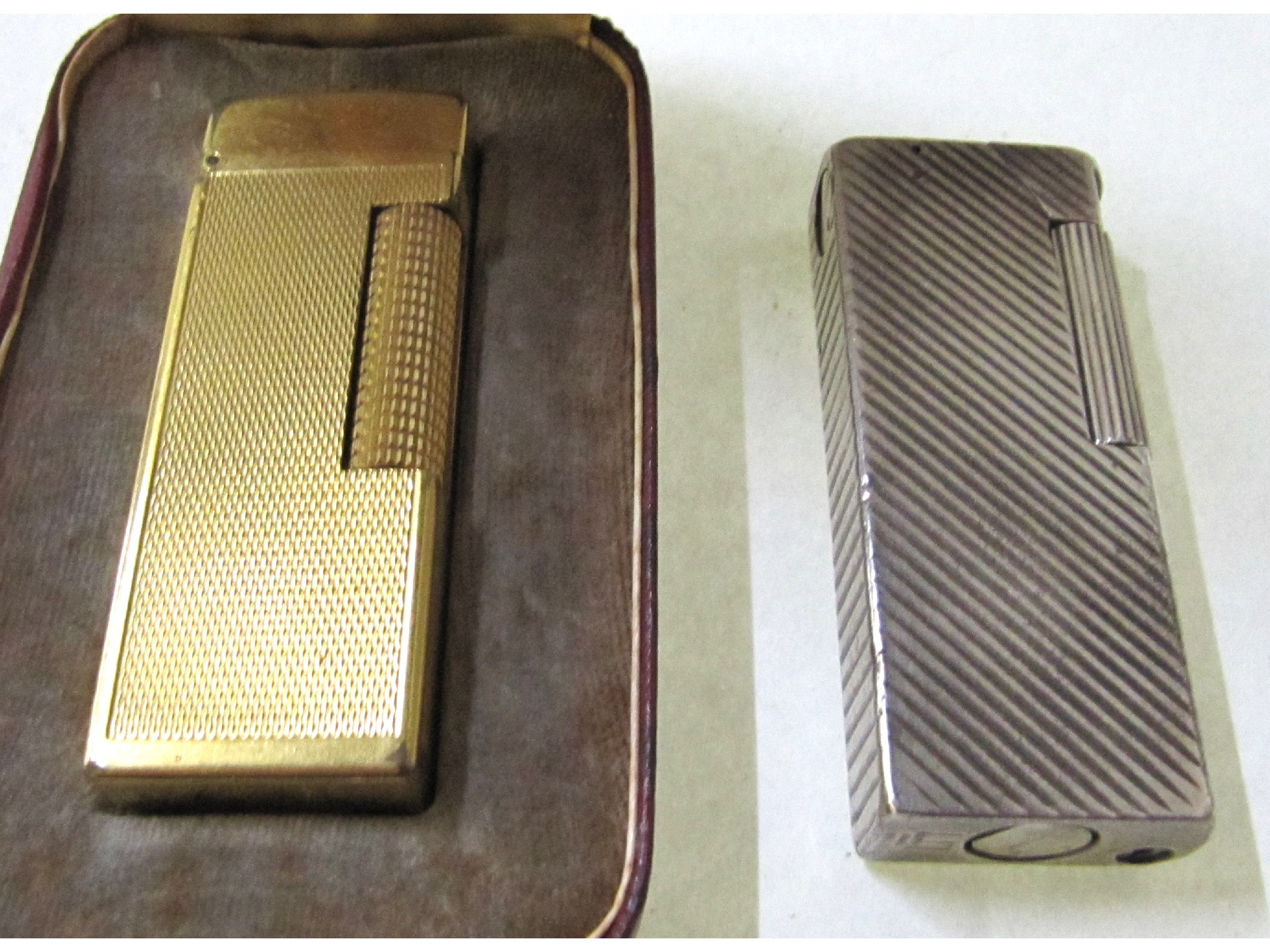 Appraisal: A lot comprising two Dunhill cigarette lighters one boxed