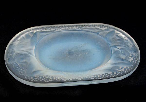 Appraisal: A Ren Lalique molded opalsecent glass ashtray Medicis Marcilhac model