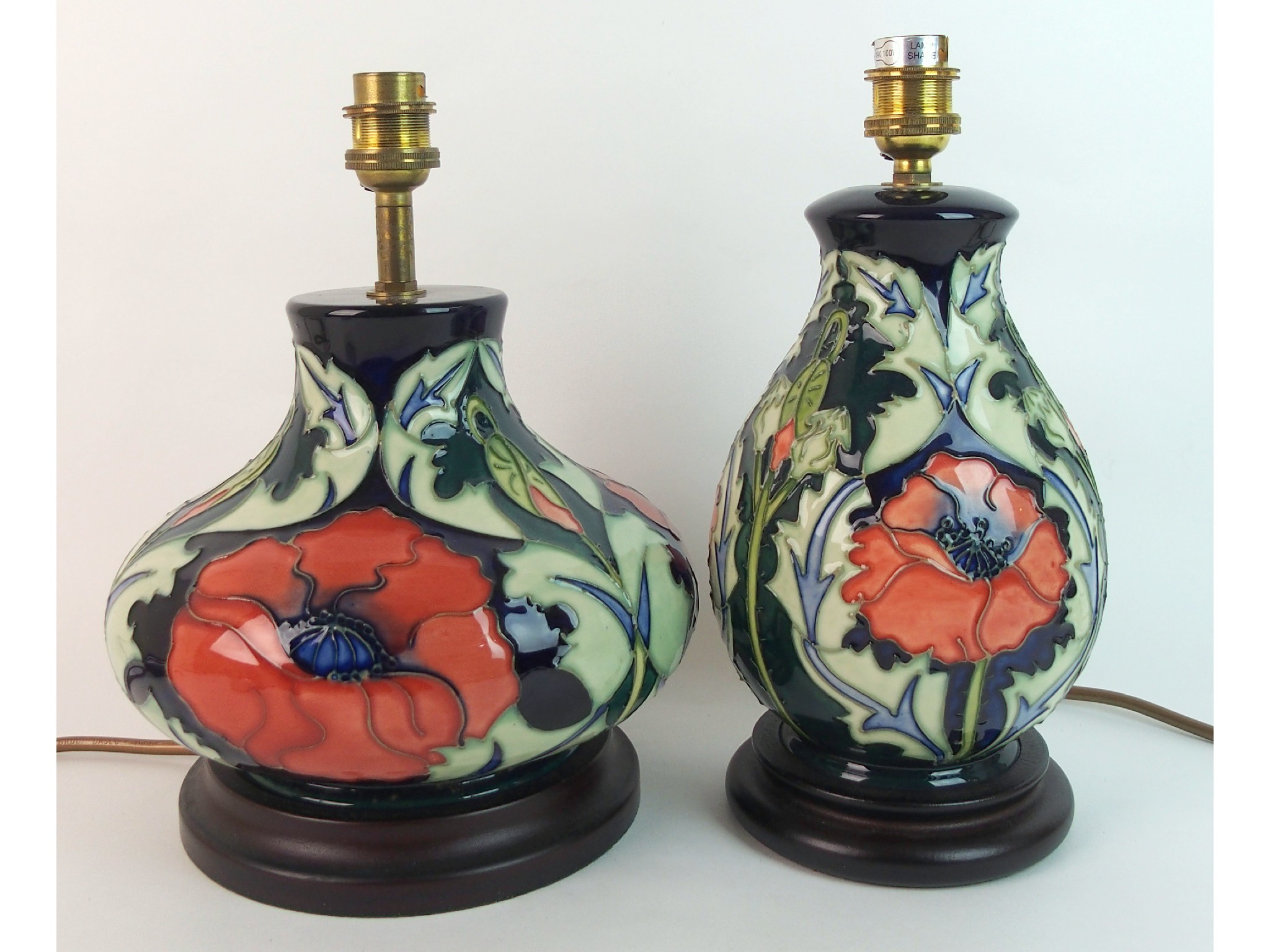 Appraisal: Two Moorcroft pottery Poppy lamp basesdesigned by Rachel Bishop decorated