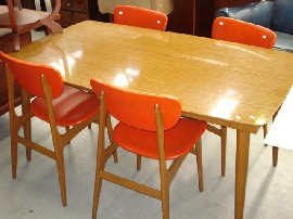 Appraisal: A set of four retro timber and orange leather dining