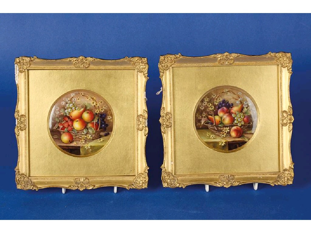 Appraisal: A PAIR OF ROYAL WORCESTER CIRCULAR PORCELAIN PLAQUES painted with