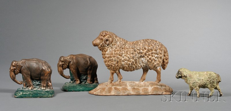 Appraisal: Painted Cast Iron Ram Doorstop Pair of Elephant Bookends and